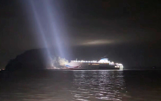 A passenger ship that hit a rock near Jangsan Island off the coast of Shinan, South Jeolla is seen on Nov. 19. [MOKPO COAST GUARD]