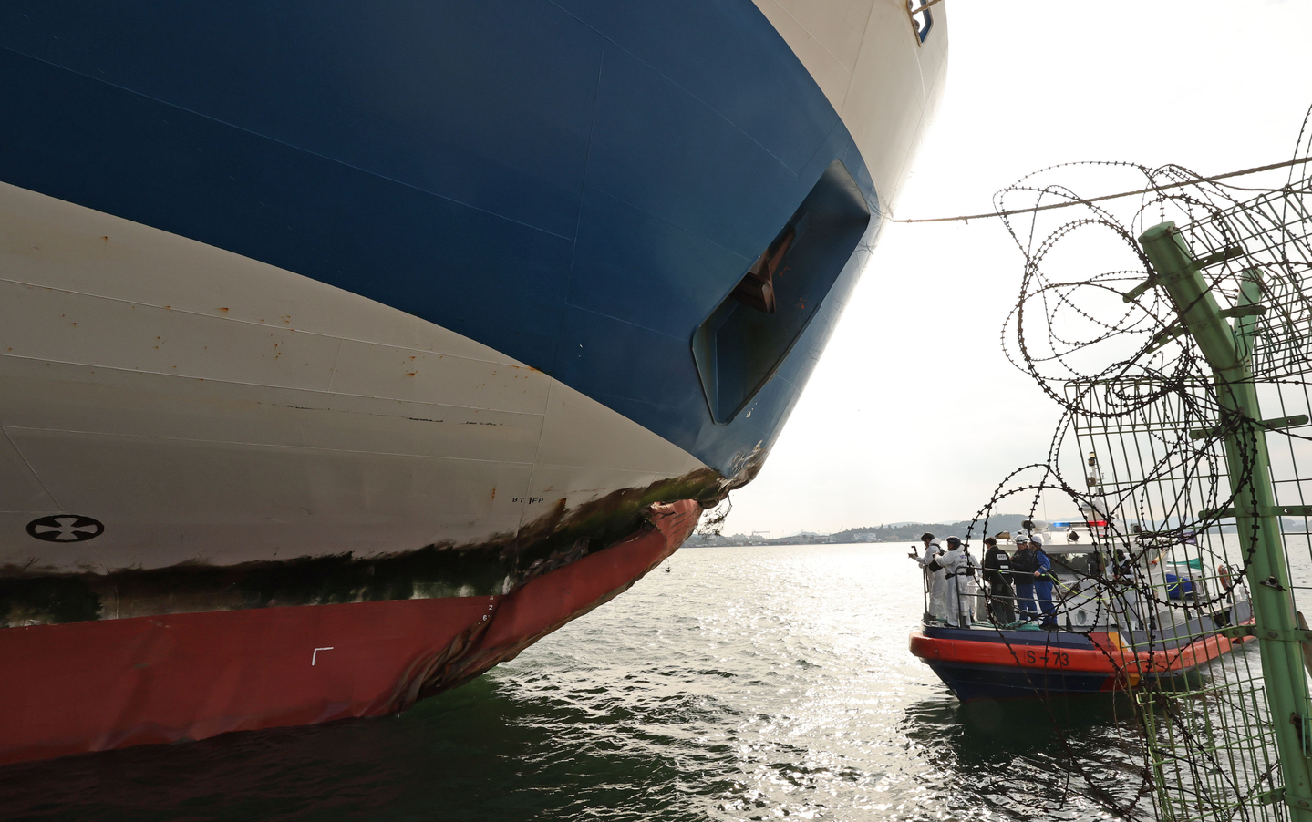 Authorities study the Queen Jenuvia II ferry at the Samhak Dock in Mokpo, South Jeolla, on Nov. 20. [NEWS1]