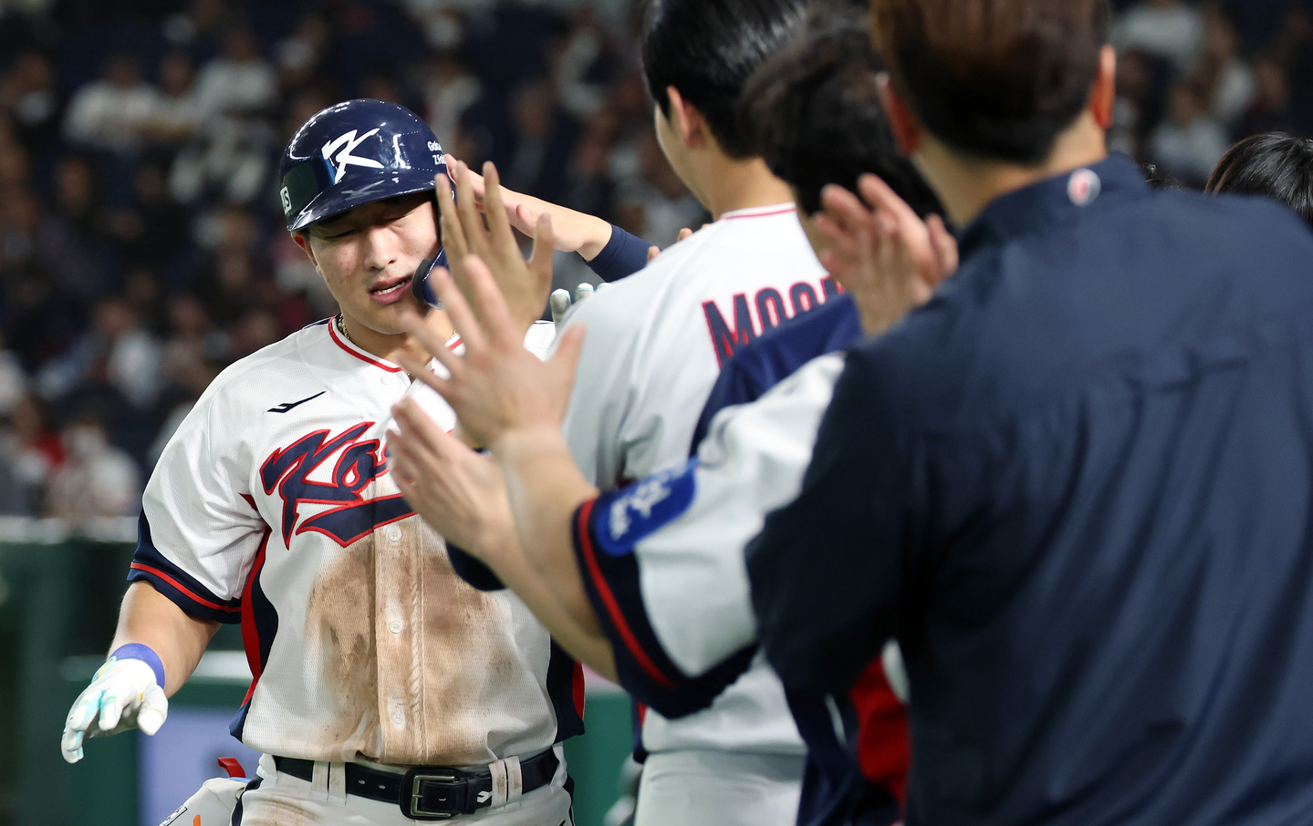 Ahn Hyun-min of the KT Wiz is congratulated by teammates after hitting a home run against Japan during the teams' exhibition baseball game at Tokyo Dome in Tokyo on Nov. 16. [YONHAP]