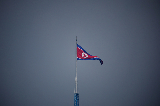 A North Korean flag flutters at the propaganda village of Gijungdong in North Korea, in this picture taken near the truce village of Panmunjom inside the demilitarized zone separating the two Koreas, South Korea on July 19, 2022. [REUTERS/YONHAP] 