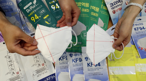 Employees of the Korea Consumer Agency explain the products tested during a briefing on “KF94 disposable mask price and quality comparison information” at the Korea Fair Trade Commission press room in the Government Complex Sejong in Sejong on July 27, 2021. [NEWS1]