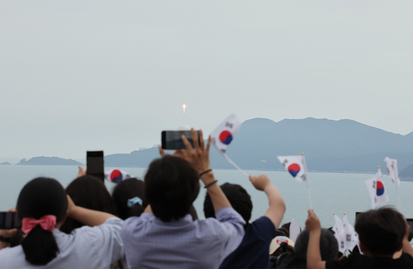 People watch from the Goheung Space Launch Observatory in Goheung, South Jeolla as Korea's homegrown space rocket Nuri has its third launch on May 25, 2023. [YONHAP] 