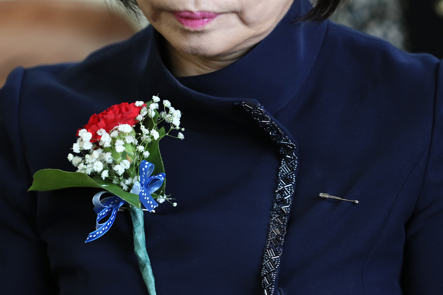 A teacher wears a carnation for Teachers’ Day. [YONHAP]