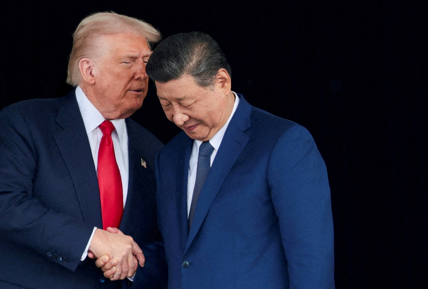 U.S. President Donald Trump and Chinese President Xi Jinping talk as they leave after a bilateral meeting at Gimhae International Airport, on the sidelines of the Asia-Pacific Economic Cooperation (APEC) summit, in Busan on Oct. 30. [REUTERS/YONHAP]