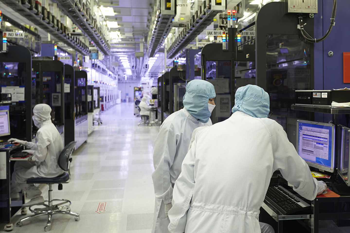 Workers are seen on the production line of SK hynix's memory chip plant in this undated file photo. [SK HYNIX]