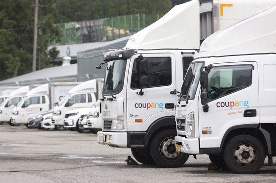 Vehicles are seen at a Coupang logistics center in Seoul on Aug. 6. [YONHAP] 