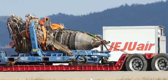 Workers are seen at the wreckage of a Jeju Air passenger aircraft that crashed at Muan International Airport on Dec. 29, 2024, on Jan. 4. [NEWS1]