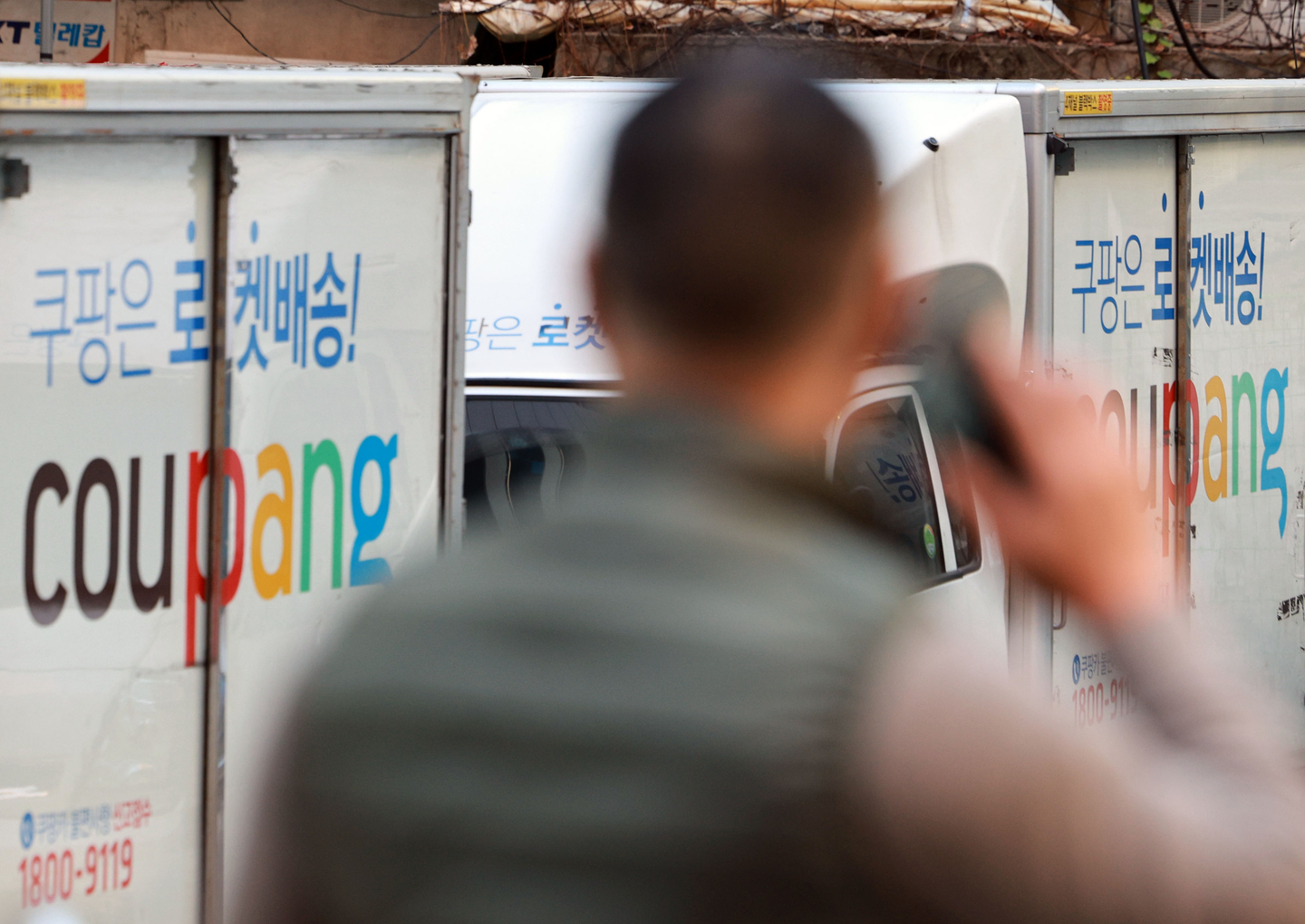 Coupang delivery trucks are seen at a logistics center in Seoul on Nov. 21. [YONHAP]