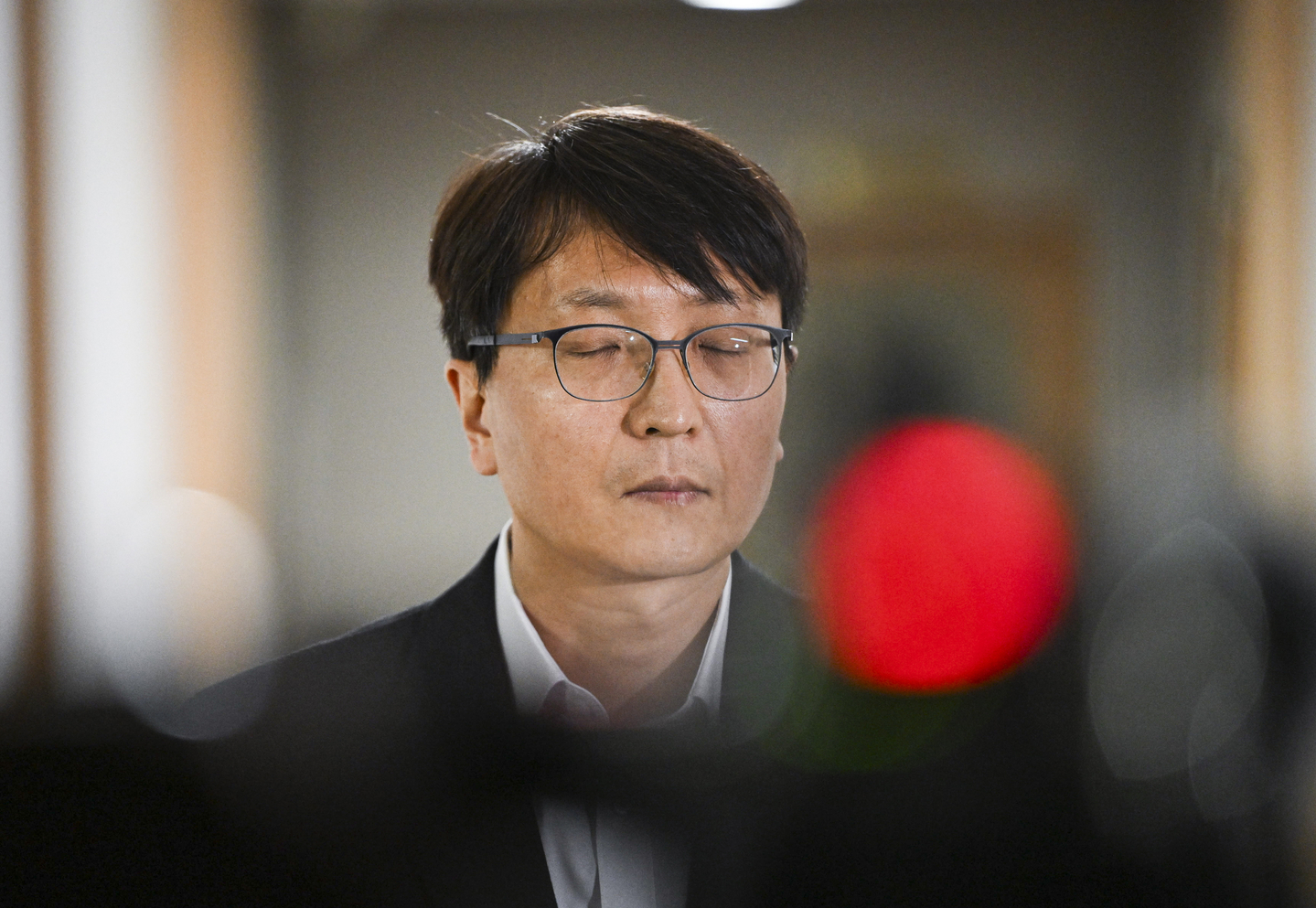 Coupang CEO Park Dae-jun closes his eyes while listening to questions from reporters after attending an emergency meeting held at the Government Complex in central Seoul on Nov. 30 [NEWS1]