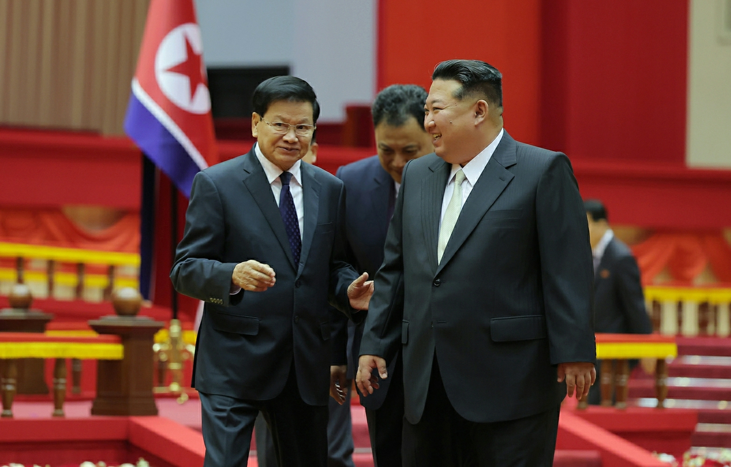 North Korean leader Kim Jong-un, right, speaks with Lao President Thongloun Sisoulith in Pyongyang on Oct. 7, as the Lao official visited the North to attend celebrations marking the 80th anniversary of the founding of the Workers' Party of Korea, in this photo from the Rodong Sinmun on Oct. 8. [RODONG SINMUN]