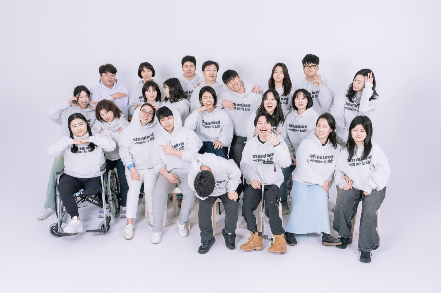 Yuhan Sun, the first on the left in the second row, poses for a group photo with Heartyworks' staff members. [HEARTYWORKS]