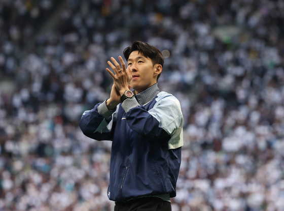 Son Heung-min, then the Tottenham captain, applauds fans during a lap of honour after a Premier League match between Tottenham Hotspur and Brighton & Hove Albion in London on May 29. [EPA/YONHAP]