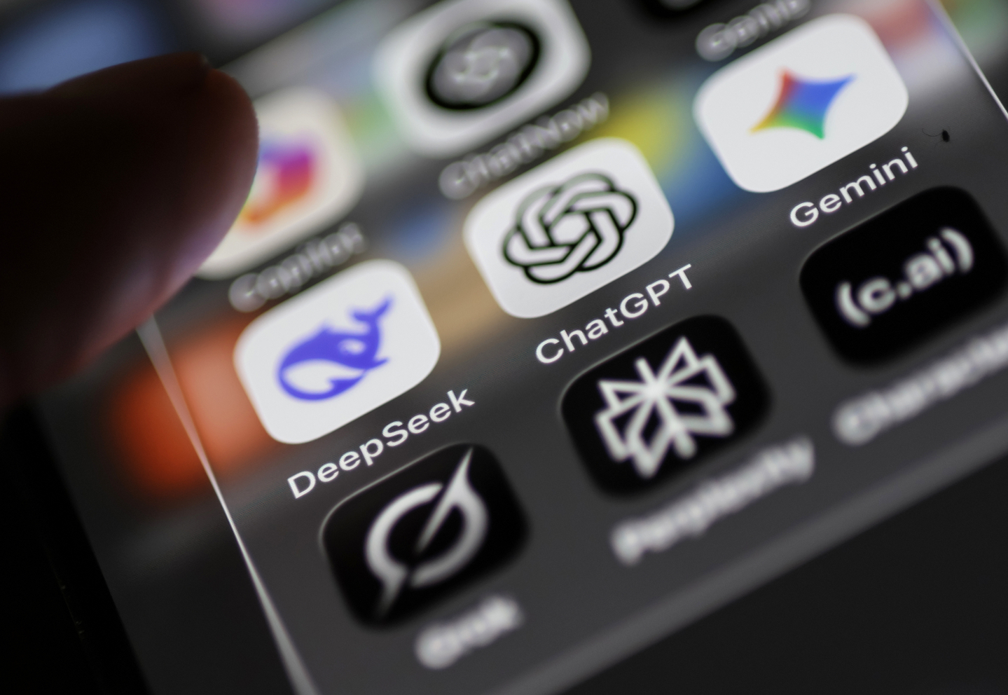 A mobile phone display shows the icons of AI apps Deepseek, Chatgpt and Gemini in Berlin on Oct. 31. [EPA/YONHAP]