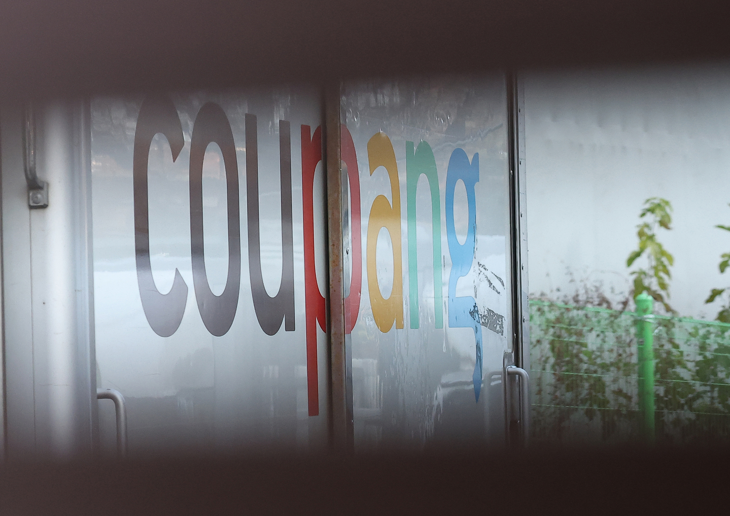 The Coupang company logo is seen on a delivery truck at a logistics center in Seoul on Dec. 1. [YONHAP]