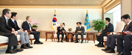 President Lee Jae Myung, right in the back, meets with SoftBank Group Chairman Masayoshi Son, left from Lee, at the presidential office in Yongsan District, central Seoul, on Dec. 5. [JOINT PRESS CORPS]