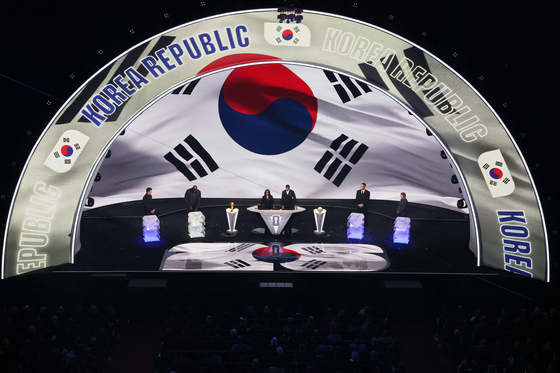 The Korean national flag, or the taegeukgi, is on display as former NBA star Shaquille O'Neal picks Korea during the draw for the 2026 FIFA World Cup at the Kennedy Center in Washington on Dec. 5. [YONHAP/REUTERS]