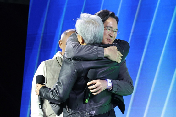 Nvidia CEO Jensen Huang and Samsung Electronics Executive Chairman Lee Jae-yong embrace as Hyundai Motor Group Executive Chair Euisun Chung looks on during an event at COEX in southern Seoul marking the 25th anniversary of Nvidia’s GeForce GPU launch on Oct. 30. [JOINT PRESS CORPS]