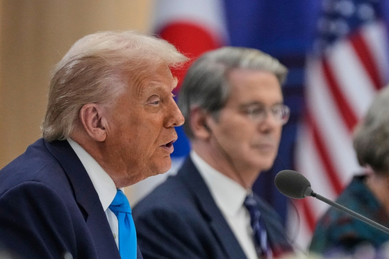 U.S. President Donald Trump, with U.S. Treasury Secretary Scott Bessent, right, speaks during a talk with President Lee Jae Myung, unseen in this photo, at the Gyeongju National Museum in Gyeongju, North Gyeongsang, on Oct. 29. [AP/YONHAP]