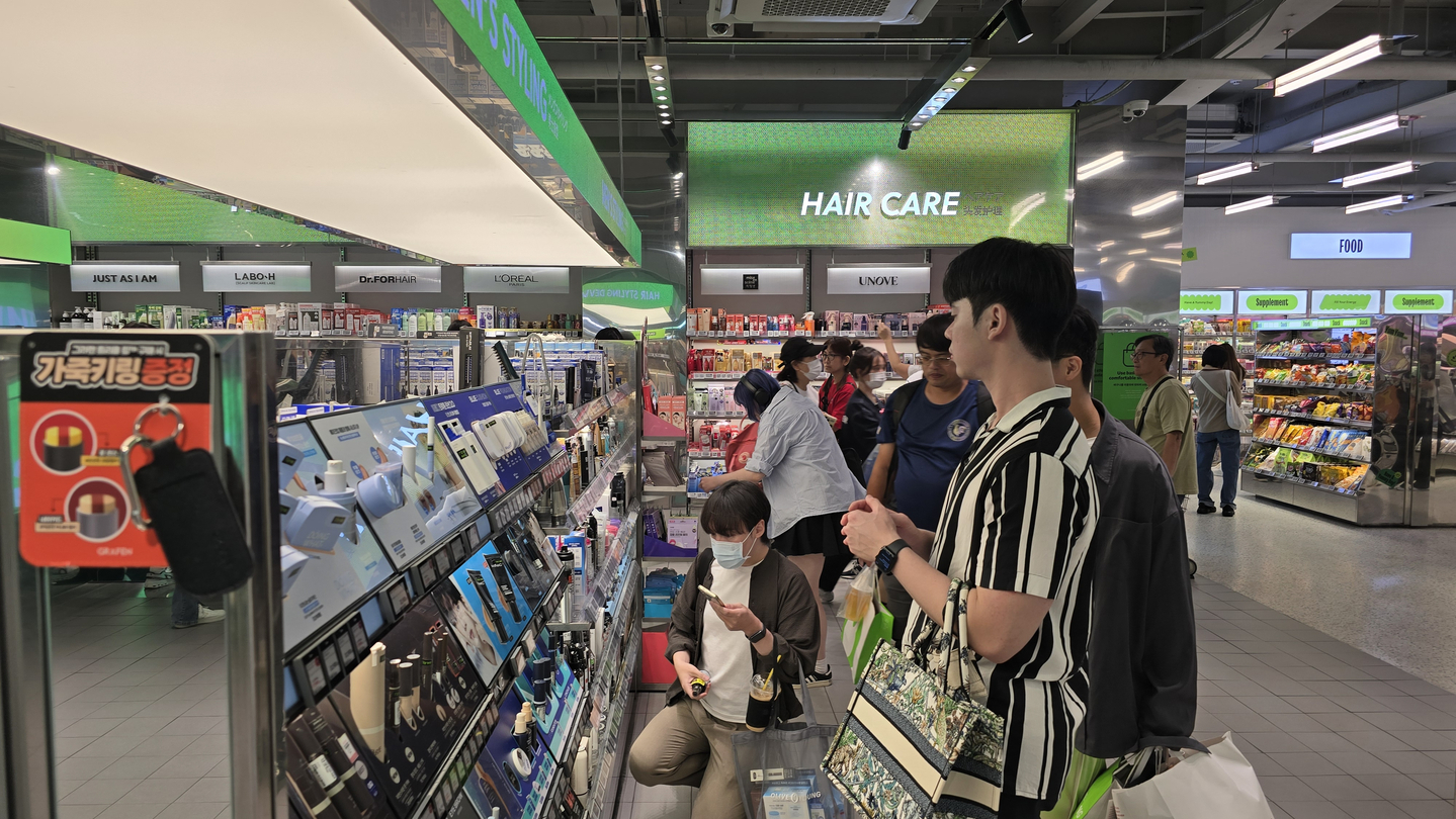Customers are seen browsing products at an Olive Young store in Jung District, central Seoul, on Sept. 29. [NOH YU-RIM]