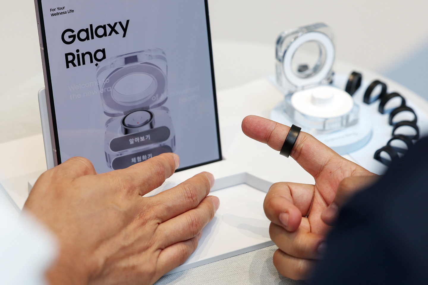 Customers try on the Galaxy Ring at the Samsung Store Hongdae in Mapo District, western Seoul, on July 11, 2024. [NEWS1]