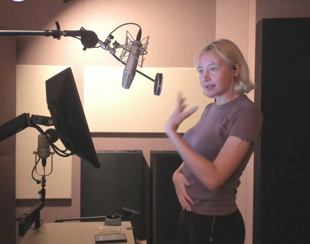 Voice actor Brooke Megan Goodman records in a studio. [BROOKE MEGAN GOODMAN]