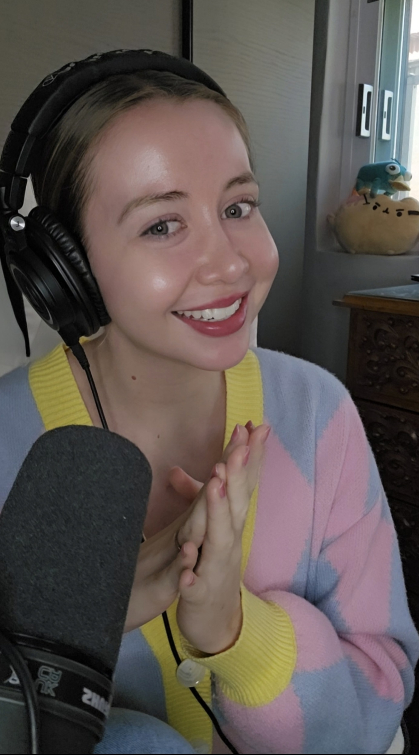 Voice actor Brooke Megan Goodman poses for a photo after recording in her room. [BROOKE MEGAN GOODMAN]