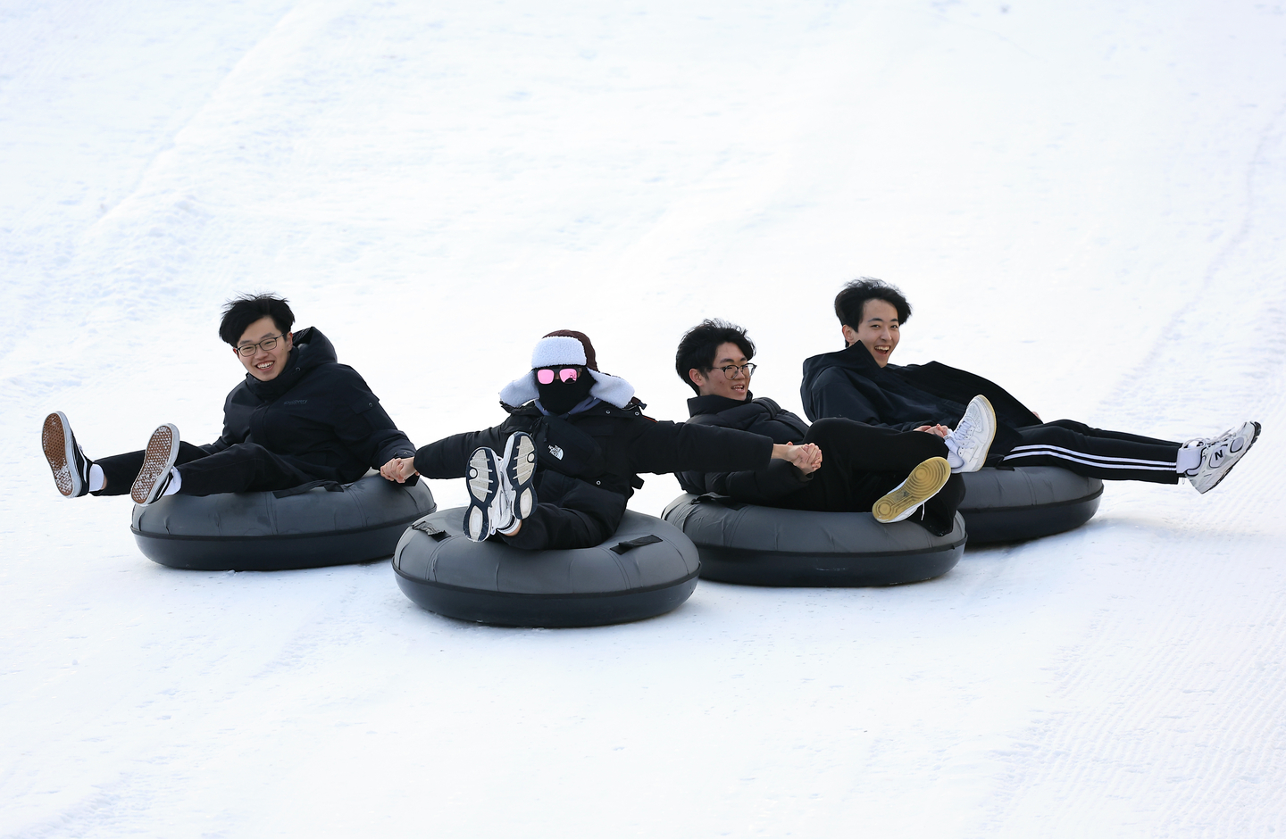 Students are seen sledding down a snow range in Dongdaemun Dsitrict, central Seoul on Dec. 20, 2024. [NEWS1] 