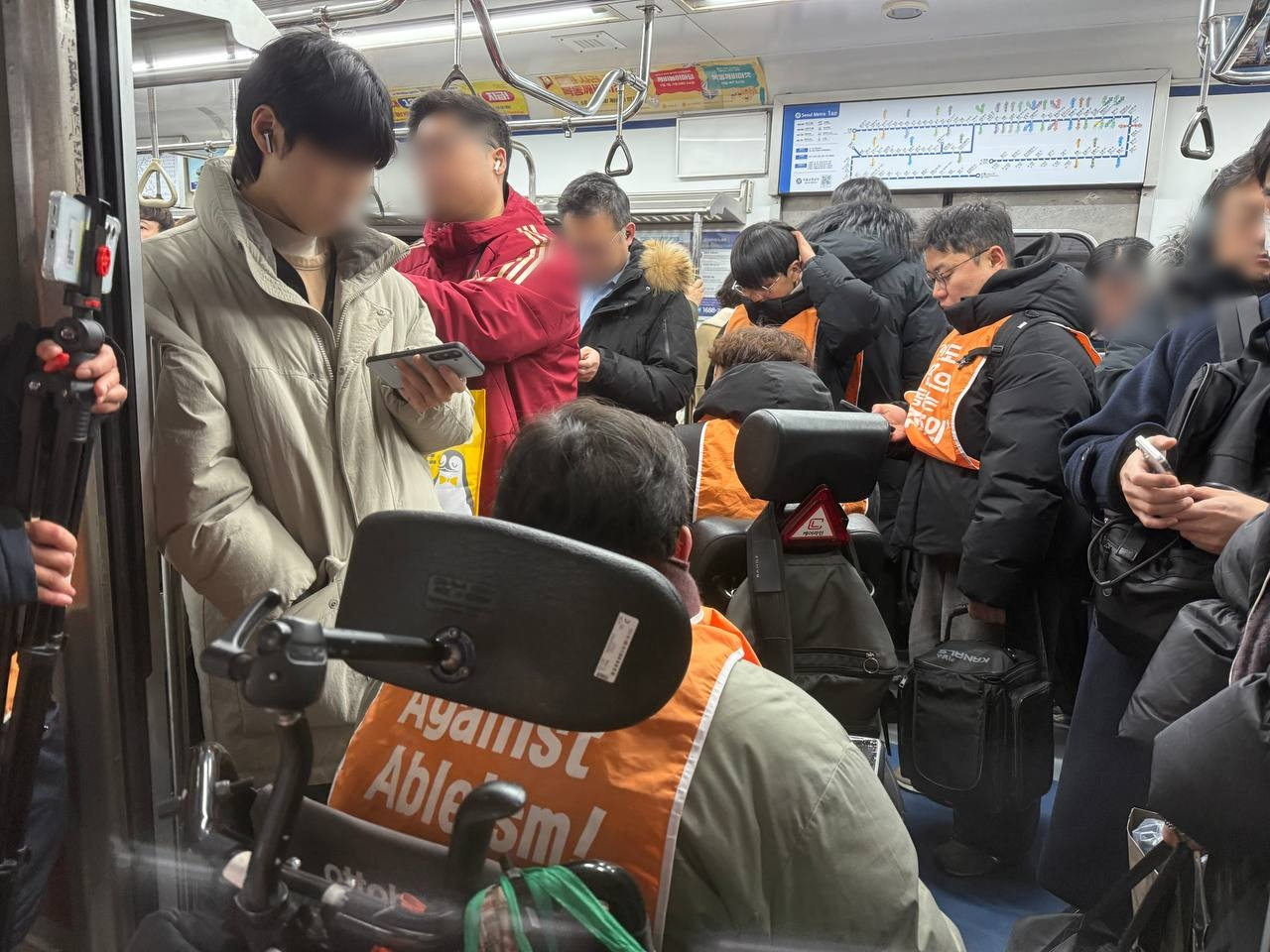 The Solidarity Against Disability Discrimination protests on a subway in this undated photo provided by the group. [SADD]
