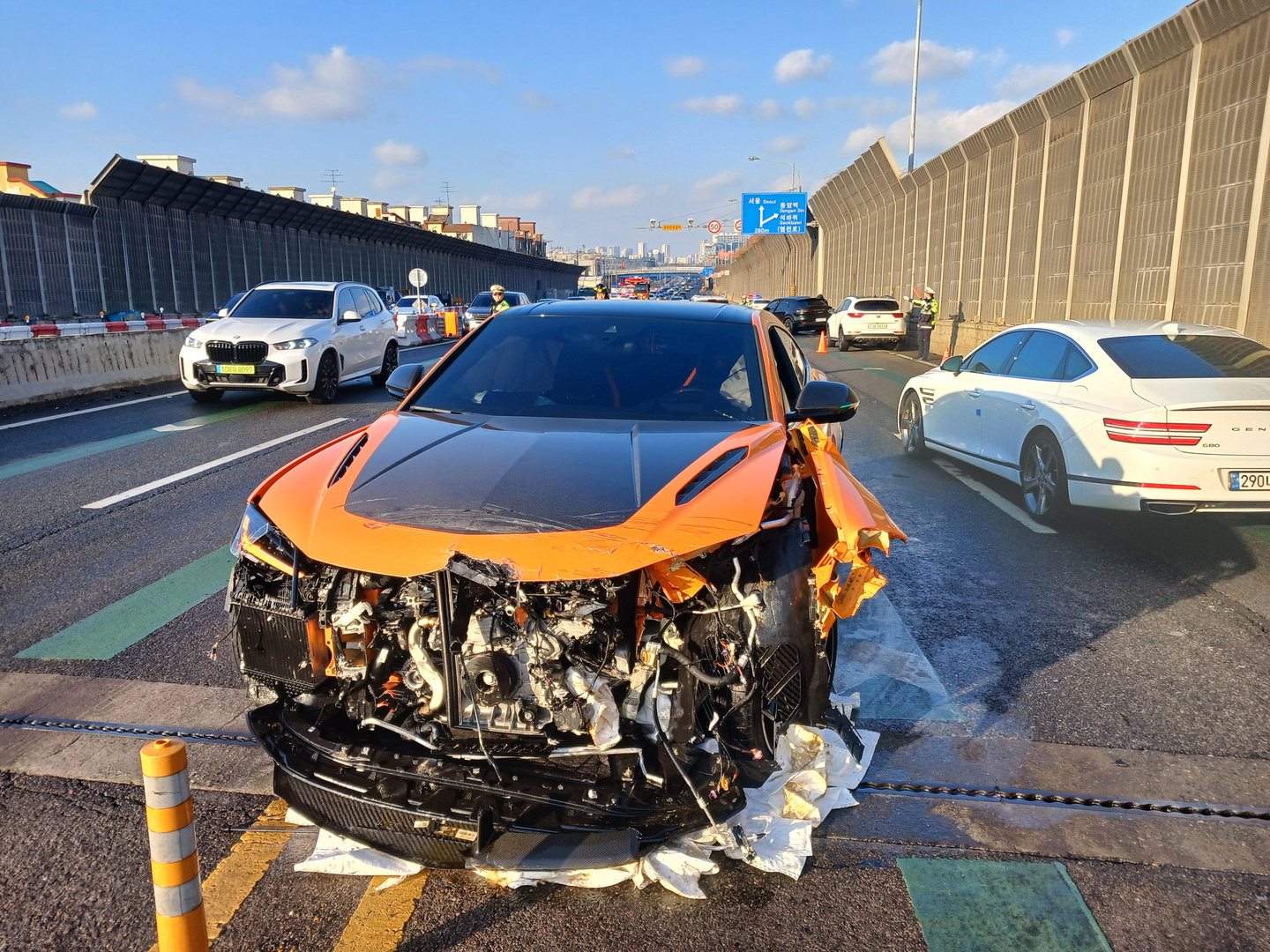 A damaged Lamborghini lies on Incheon-daero near the Dohwa Interchange in Dohwa-dong, Michuhol District, Incheon, on Dec. 14. [INCHEON FIRE SERVICES]