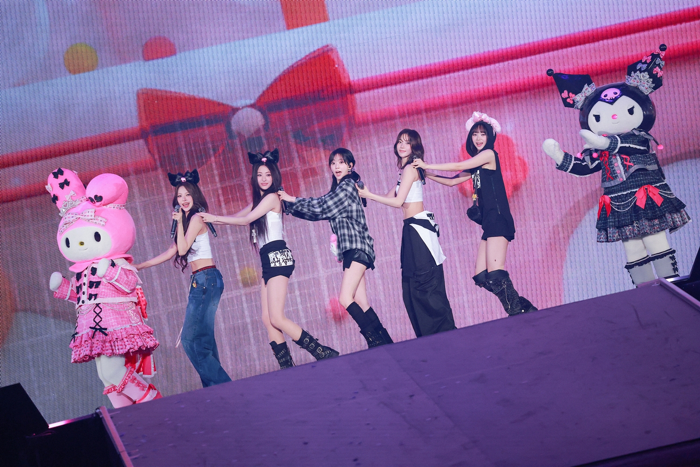 Girl group Le Sserafim performs at the Tokyo Dome in Japan on Nov. 18 and 19 as part of the ″Easy Crazy Hot″ world tour. [SOURCE MUSIC]