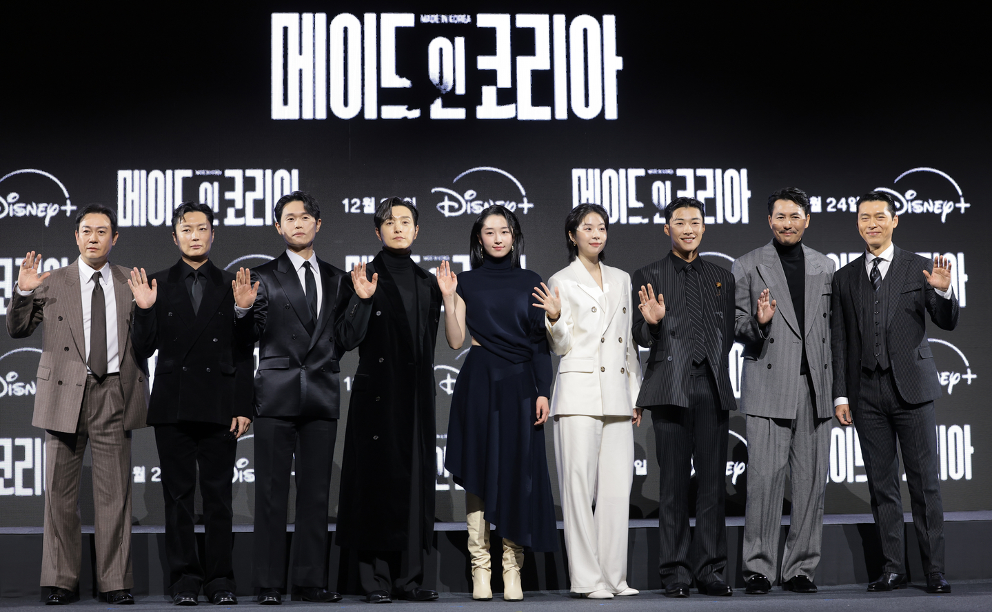 The cast of Disney+'s ″Made in Korea″ poses for photos during the show's press conference held in southern Seoul on Dec. 15. From left are actors Park Yong-woo, Roh Jae-won, Kang Gil-woo, Jung Sung-il, Won Ji-an, Seo Eun-soo, Woo Do-hwan, Jung Woo-sung and Hyun Bin. [NEWS1]