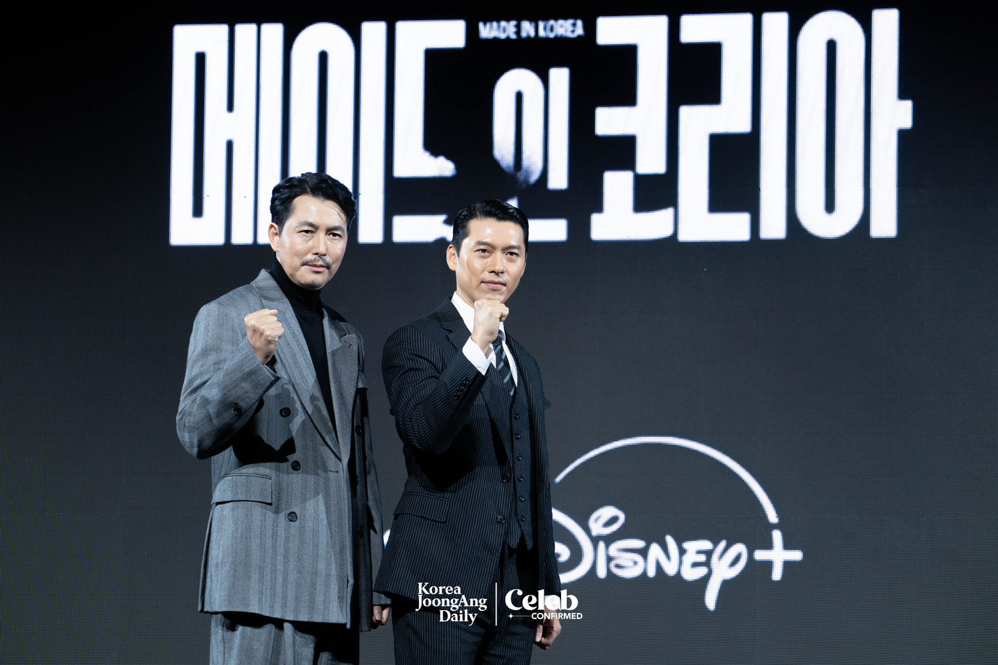 Actors Hyun Bin and Jung Woo-sung pose for photos during a press conference for the Disney+ series “Made in Korea” at the Grand InterContinental Seoul Parnas in southern Seoul on Dec. 15. [DANIELA GONZALEZ PEREZ]