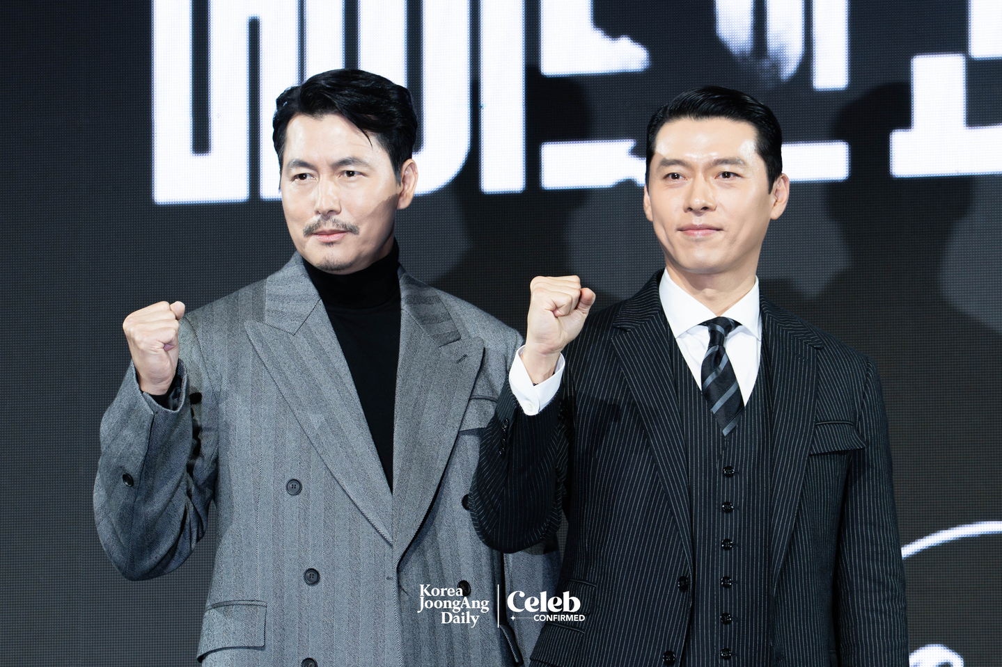 Actors Hyun Bin and Jung Woo-sung pose for photos during a press conference for the Disney+ series “Made in Korea” at the Grand InterContinental Seoul Parnas in southern Seoul on Dec. 15. [DANIELA GONZALEZ PEREZ]