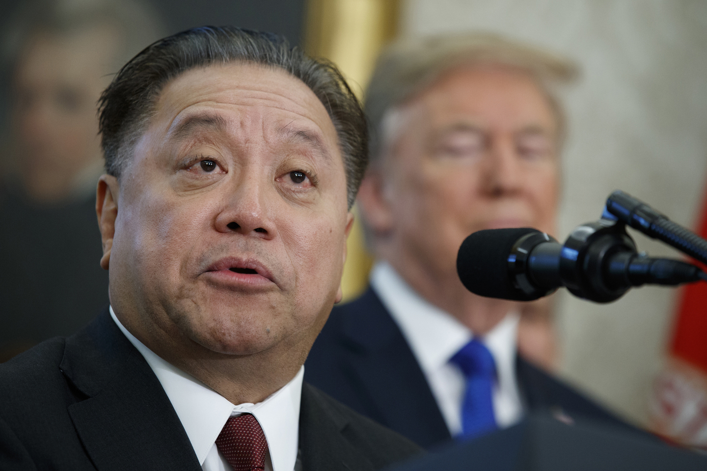 Broadcom CEO Hock Tan speaks as President Donald Trump listens during an event on Nov. 2, 2017, in Washington. [AP/YONHAP]