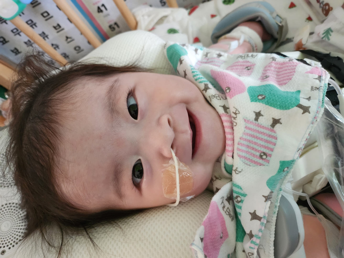 Eight-month-old Park Seo-rin, who was born with an exposed heart, is healthy and smiling after multiple surgeries at Seoul Asan Medical Center. [SEOUL ASAN MEDICAL CENTER]