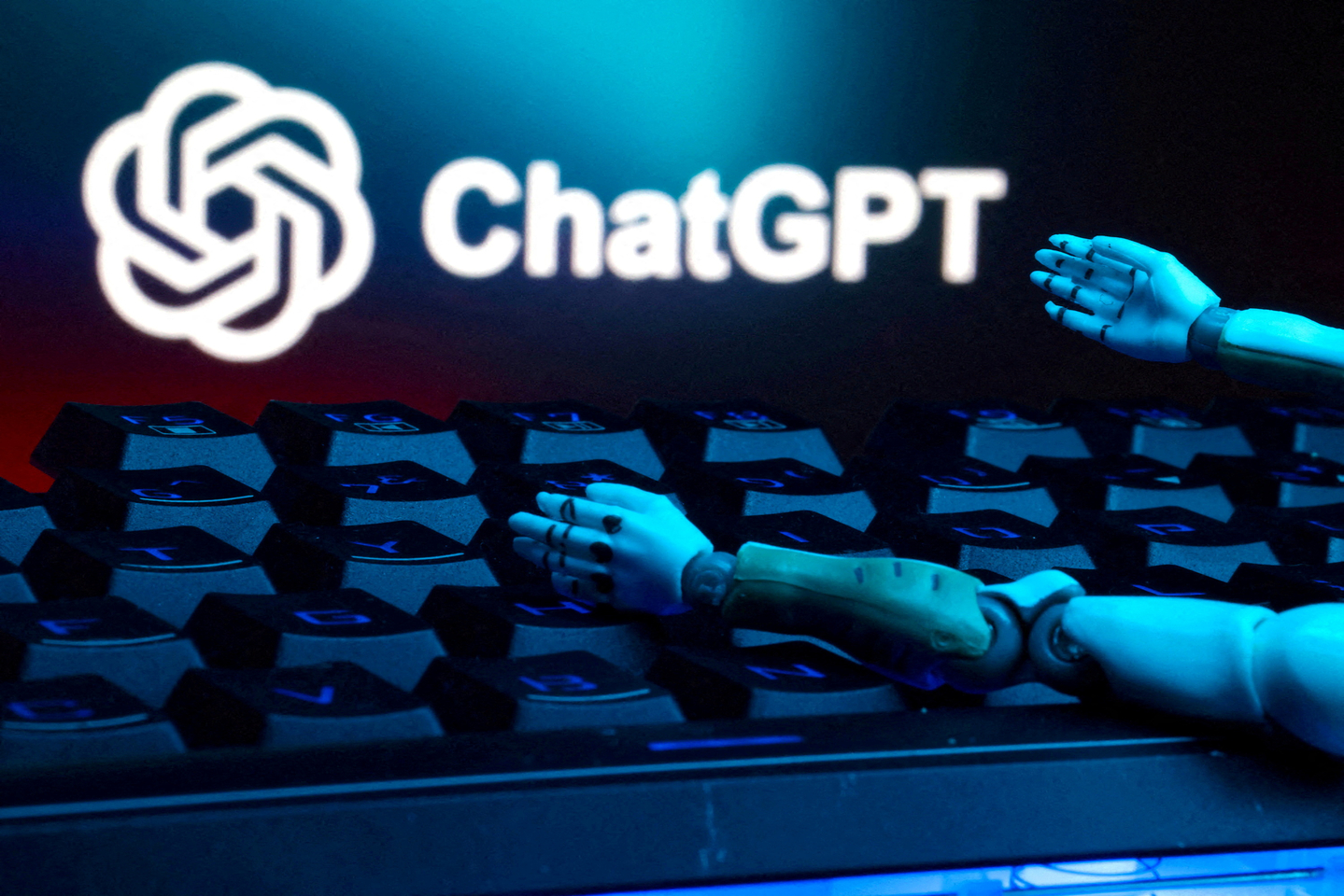 The ChatGPT logo, a keyboard and robot hands are seen in this illustration taken on Jan. 27. [REUTERS/YONHAP]