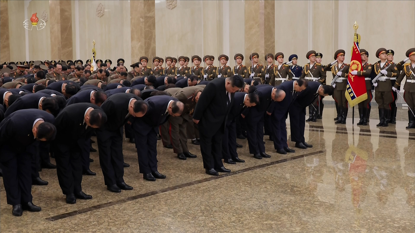 North Korean leader Kim Jong-un, fifth from left, and other senior officials from the ruling Workers' Party and military pay tribute to the late Kim Jong-il in a visit to Kumsusan Palace of the Sun in Pyongyang as the North marks the 14th anniversary of the former leader's death. Kim Jong-un visited at midnight on Dec. 16, state-run media reported. [KOREAN CENTRAL TELEVISION]