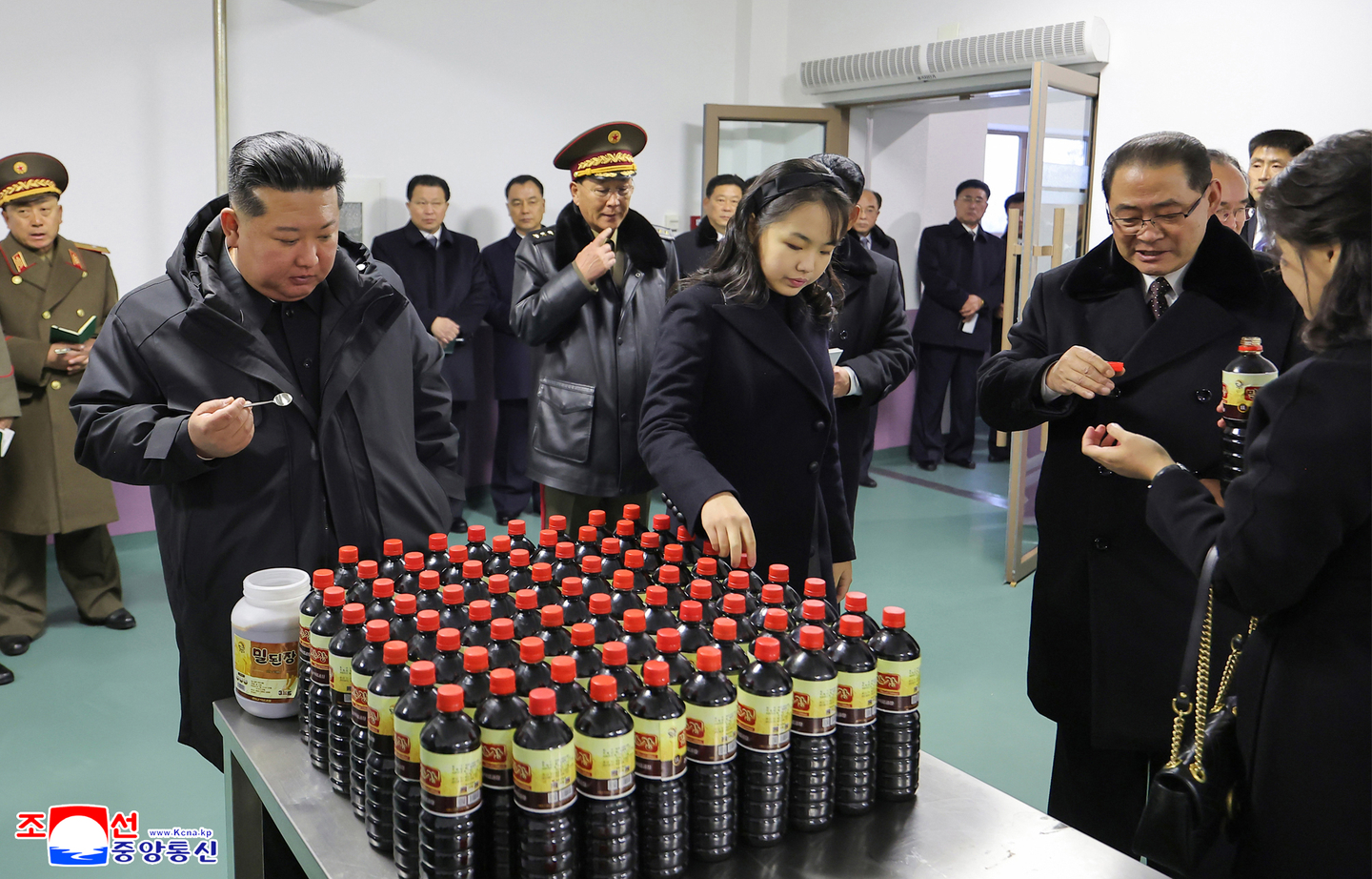 Kim Jong-un, left, tours newly built facilities in Gangdong County, on the outskirts of Pyongyang, with his daughter Kim Ju-ae, to the state leader's right, and his wife, Ri Sol-ju, far right of the picture, on Dec. 15. [KOREAN CENTRAL NEWS AGENCY]