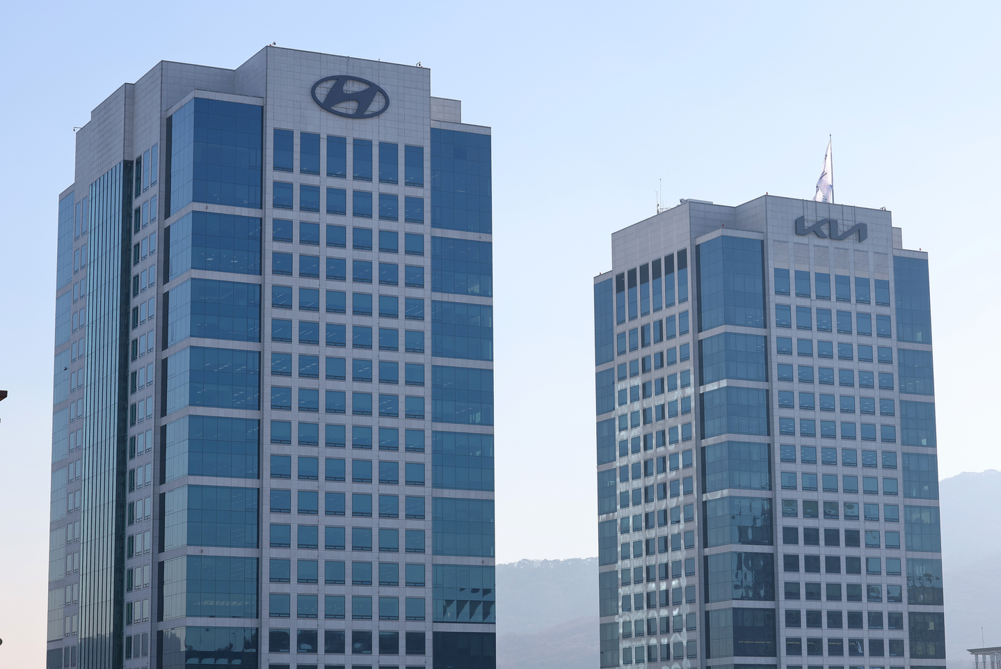 The Hyundai Motor and Kia logos are seen at the firms' headquarters in Seocho District, southern Seoul, on Jan. 23. [NEWS1]