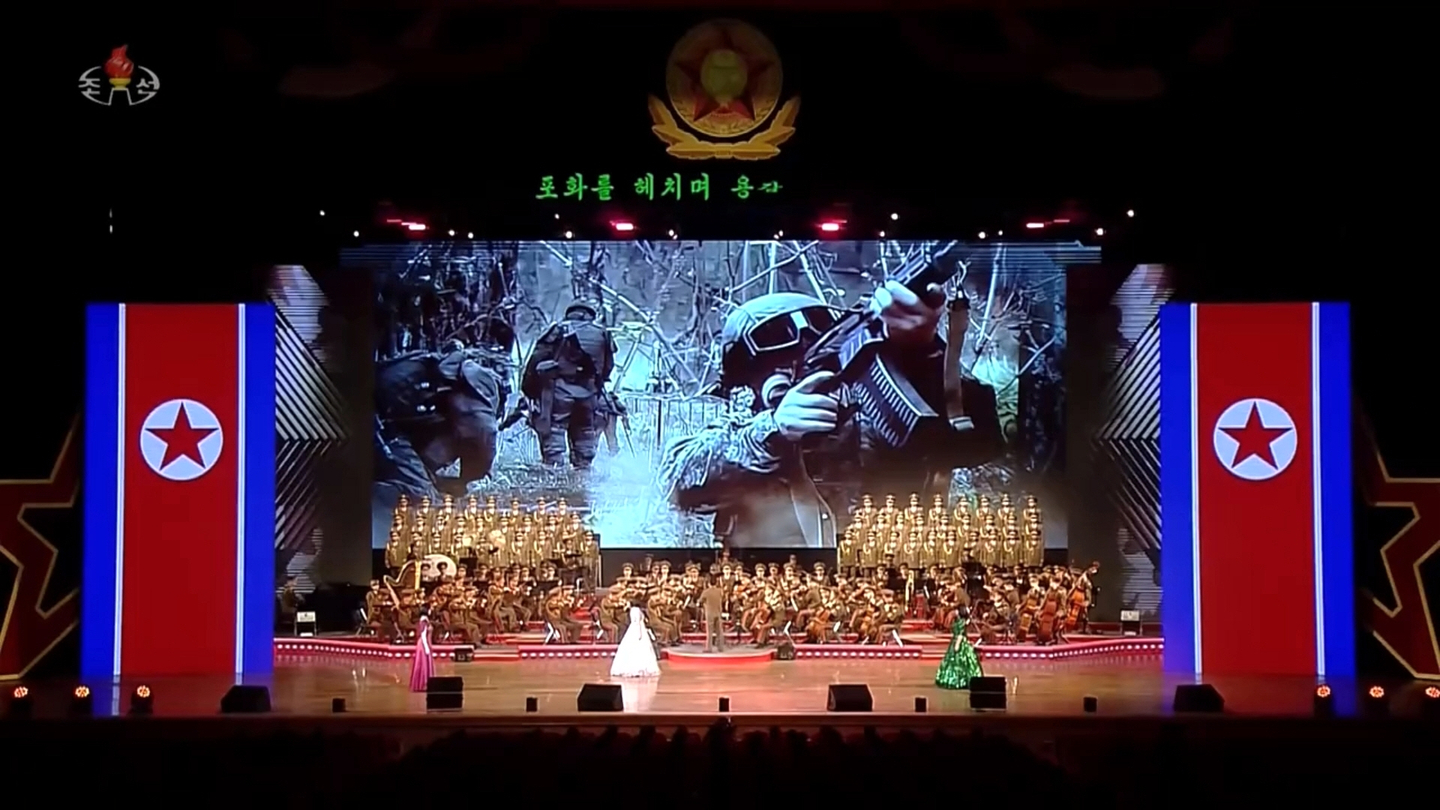 A photo showing members of the 528th Engineer Regiment, the North Korean unit dispatched to Russia, is aired during a celebratory performance welcoming the engineering troops back home on Dec. 13. [KOREA CENTRAL TV]