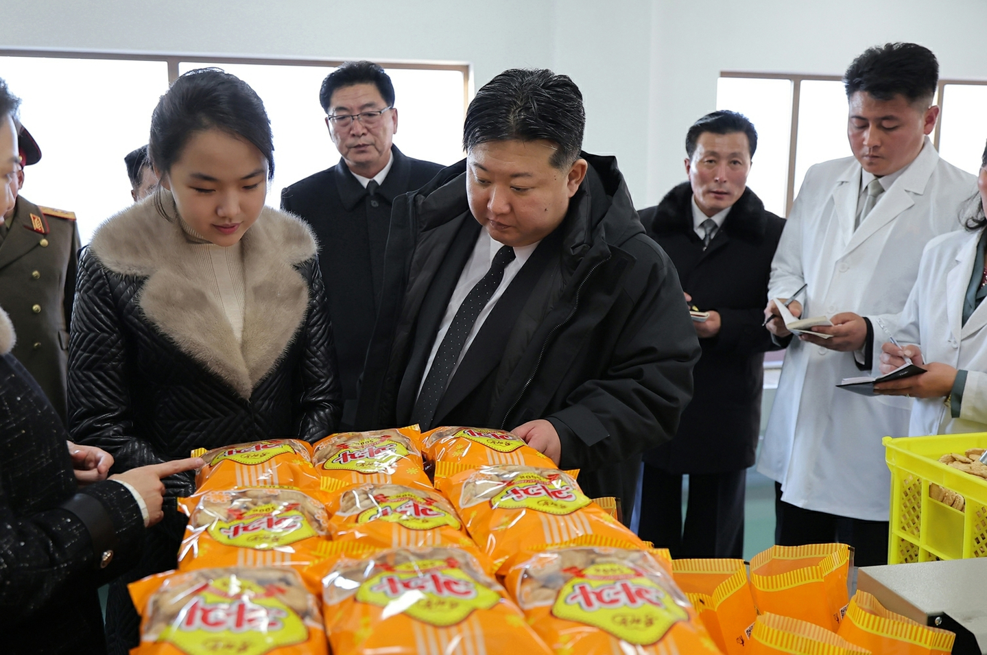 North Korean leader Kim Jong-un, right and his daughter, Kim Ju-ae, inspect products at a new factory in Sinpho on Dec. 19. [NEWS1]