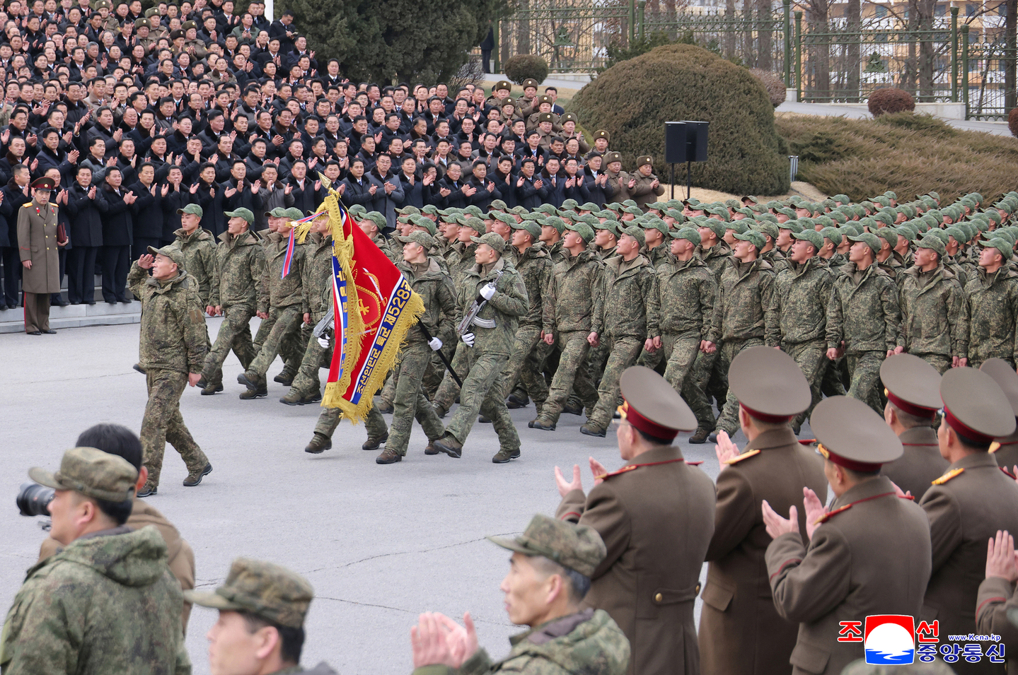 Soldiers march during a welcoming ceremony for the 528th Regiment of Engineers returning from overseas operations in Pyongyang on Dec. 12, in this photo released by the Korean Central News Agency on Dec. 13. [KOREAN CENTRAL NEWS AGENCY]