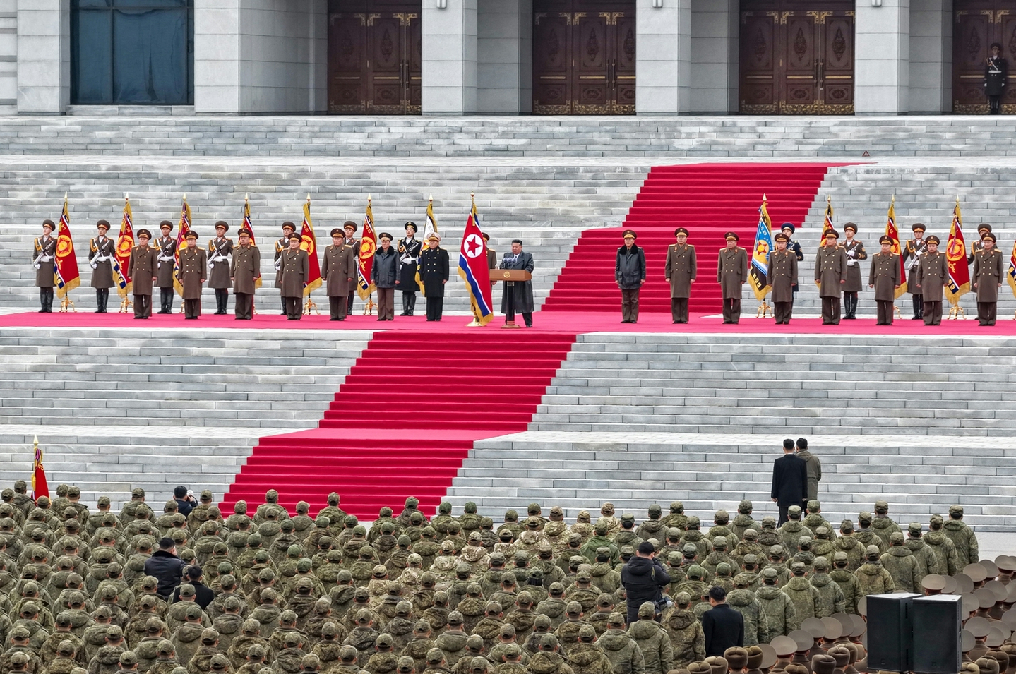 North Korean leader Kim Jong-un greets members of the 528th Regiment of Engineers returning from overseas operations at a welcoming ceremony in Pyongyang on Dec. 12 in this photo released by Rodong Sinmun on Dec. 13. [RODONG SINMUN]