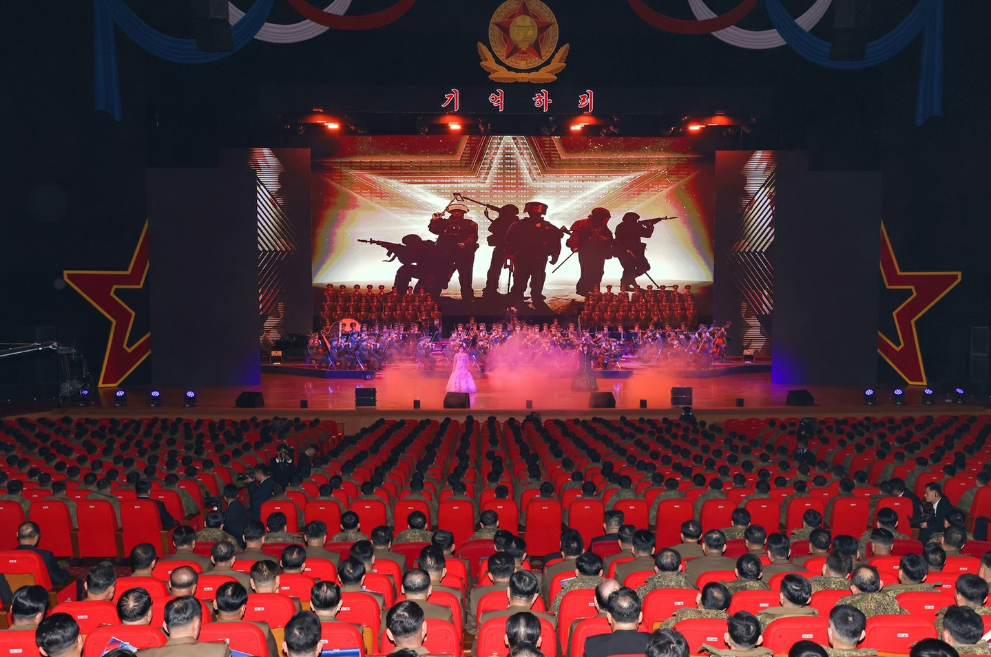 A video is screened at a welcoming ceremony in Pyongyang for the 528th Regiment of Engineers returning from overseas operations on Dec. 12, in this photo released by the Rodong Sinmun on Dec. 13. [RODONG SINMUN]