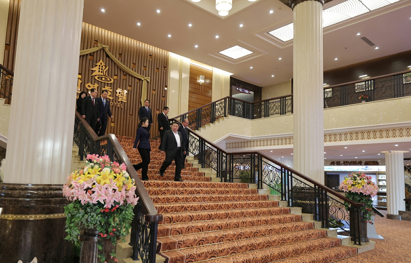 North Korean leader Kim Jong-un, right on the stairs, and his daughter, Kim Ju-ae, attend ceremonies to inaugurate the newly built Ikkal and Milyong hotels in Samjiyon, a northern city near Mount Paektu, on Dec. 20, in this photo carried by the North's official Rodong Sinmun on Dec. 23. [RODONG SINMUN]