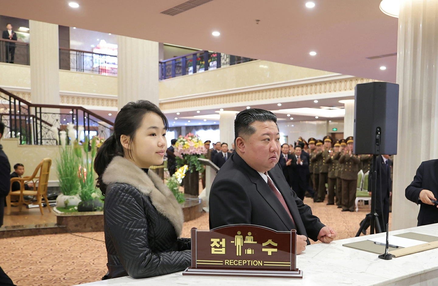 North Korean leader Kim Jong-un, right, and his daughter, Kim Ju-ae, attend ceremonies to inaugurate the newly built Ikkal and Milyong hotels in Samjiyon, a northern city near Mount Paektu, on Dec. 20, in this photo carried by the North's official Rodong Sinmun on Dec. 23. [RODONG SINMUN]