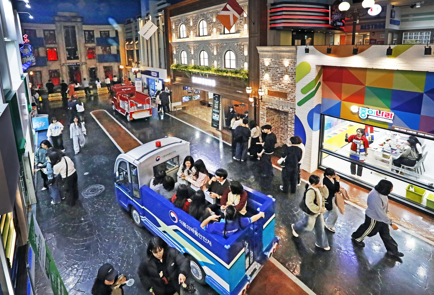 Adult participants take over the usually children-only theme park KidZania for a single-day, adult-only event in Jamsil, southern Seoul, on Dec. 20. [PARK SANG-MOON]