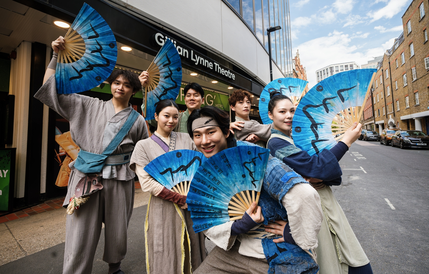 The cast of “Swag Age: Shout Out, Joseon!” poses in front of the Gillian Lynne Theatre in London on Sept. 8. [PL ENTERTAINMENT]