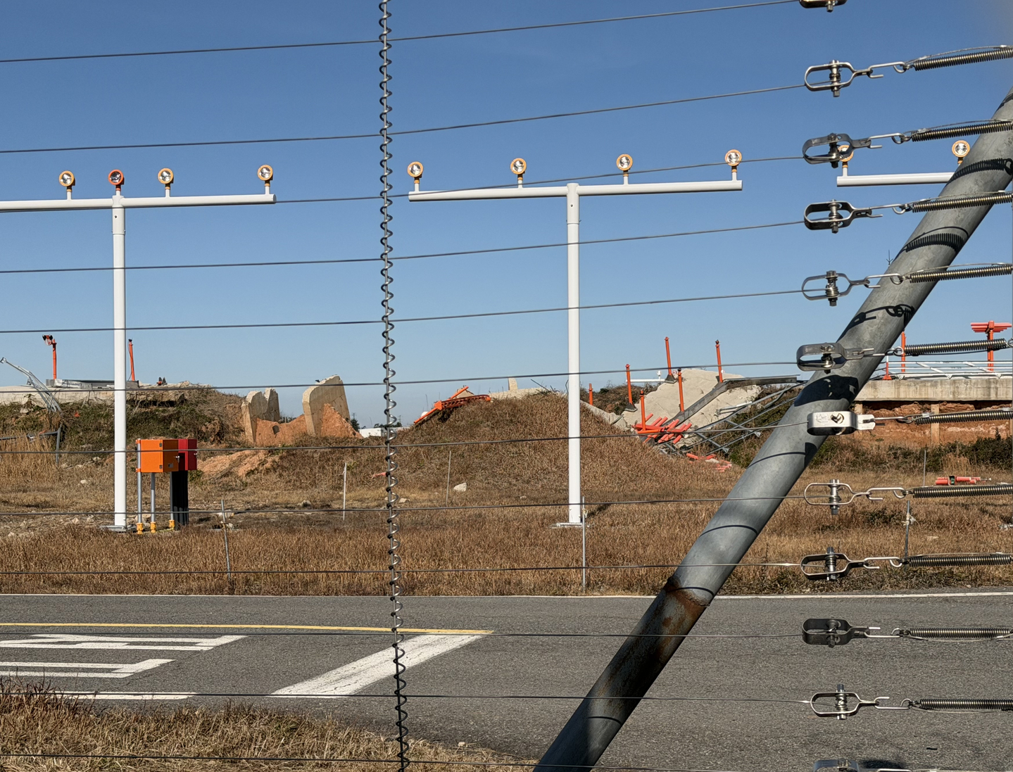 A concrete embankment that Jeju Air's B737-800 collided with is seen wrecked at Muan International Airport in South Jeolla on Dec. 22. [LEE SOO-JUNG]