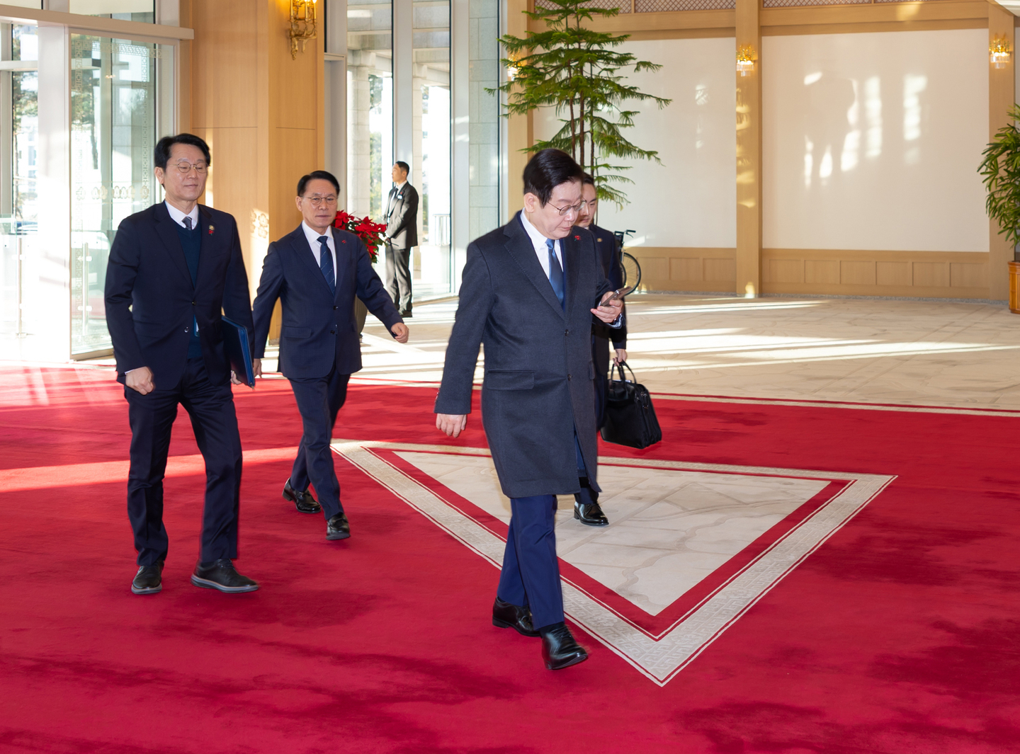 President Lee Jae Myung walks into the presidential office in Yongsan, central Seoul, for the last time on Dec. 26, as the presidential office will move back to the Blue House starting Dec. 29. [NEWS1]